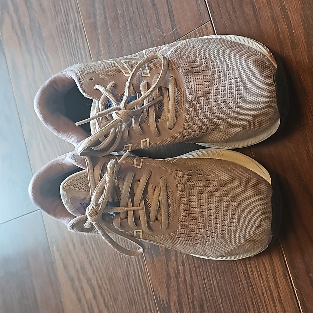 Girls ASICS running shoes.
